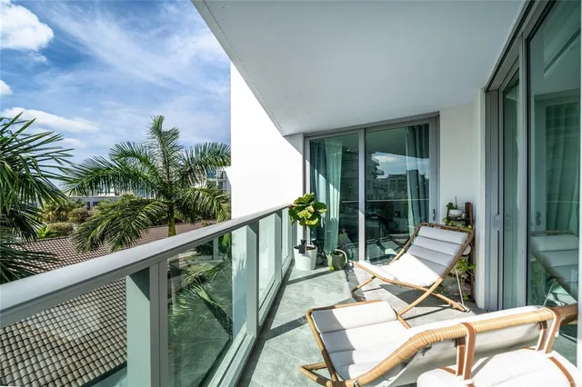 a balcony with view of outdoor space