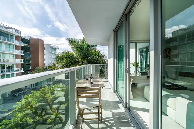 a view of a tall building from a balcony