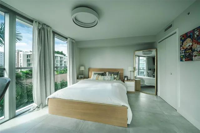 a view of walk in closet with clothes