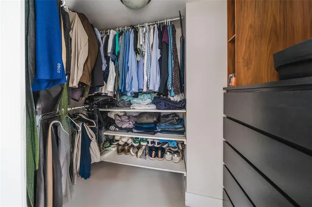 a bathroom with a tub a sink and mirror