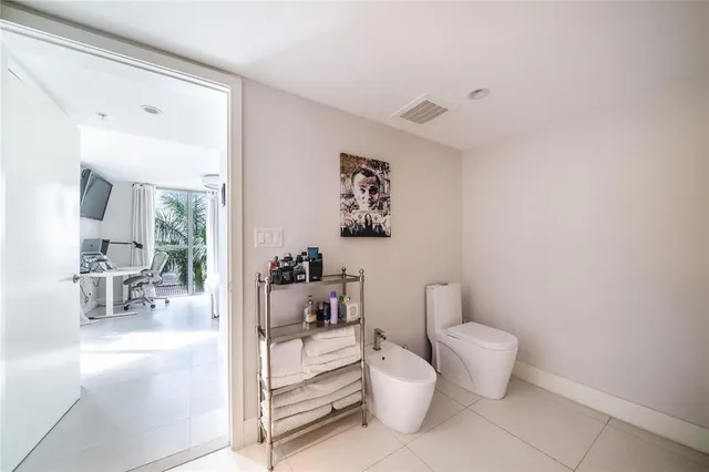 a view of a patio with a dining table and chairs