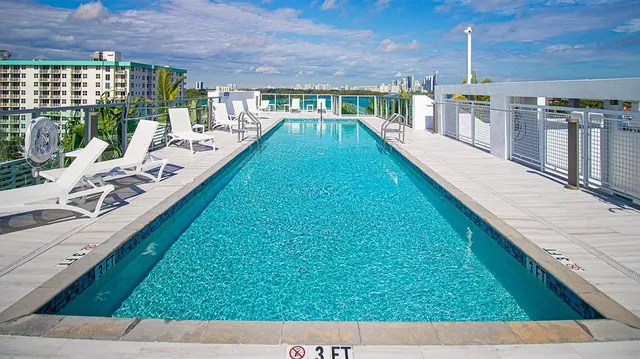 a view of a terrace with wooden floor and iron stairs