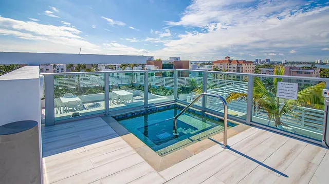 a view of a swimming pool with a lounge chair
