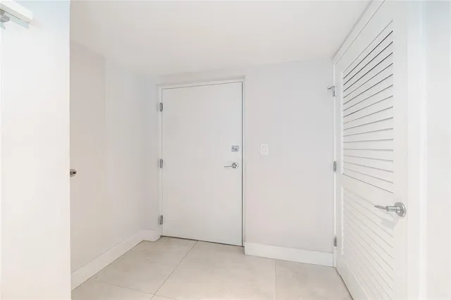 a view of a hallway with washer and dryer