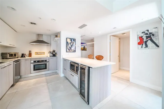 a view of a dining room with furniture and a large window