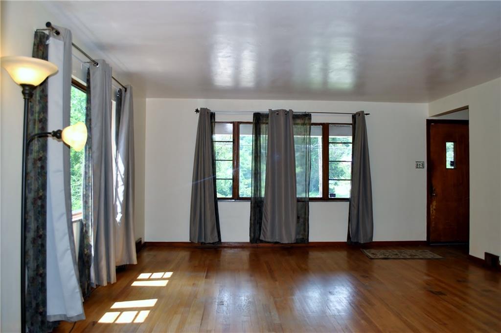 228 Bascom Avenue Pittsburgh, PA 15214 - Photo 5 of 24 Living room: so light and bright with large windows, hardwood floors, coat closet, decorative fireplace. Large space for all your entertaining needs!
