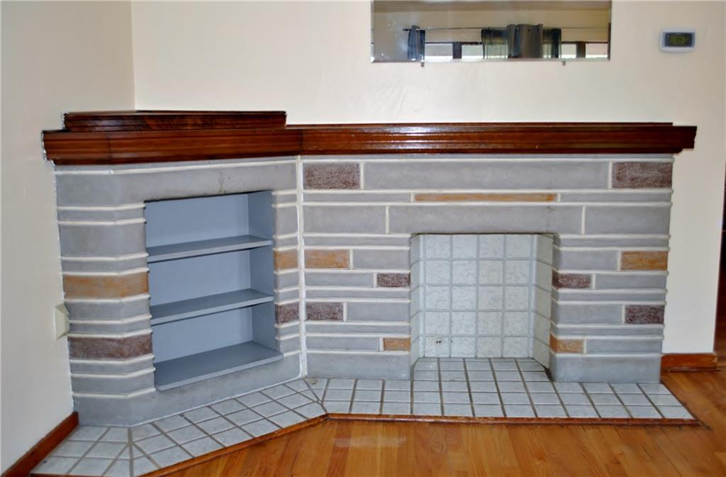 228 Bascom Avenue Pittsburgh, PA 15214 - Photo 6 of 24 What a great focal point for your living room! Decorative fireplace with addtional shelving and a gorgeous mantle.