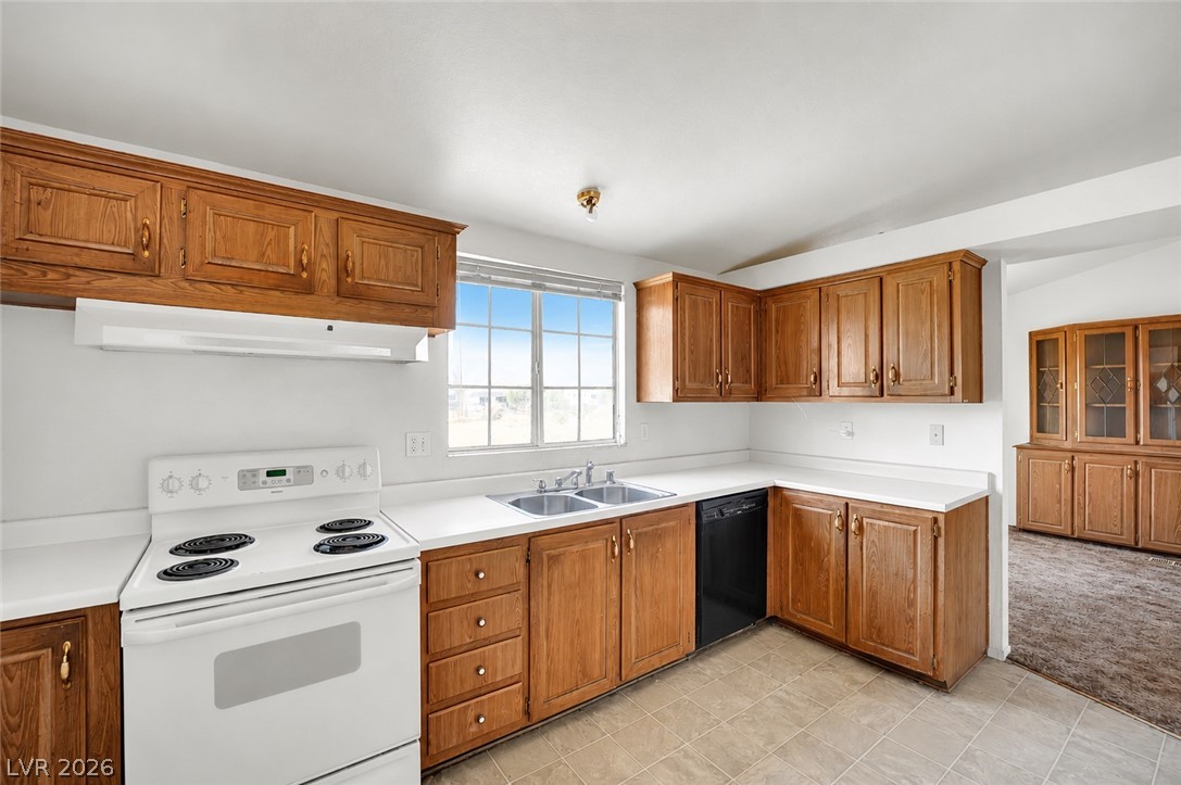 4361 Maple Road Pahrump, NV 89048 - Photo 6 of 35 A functional kitchen provides ample storage and preparation space for daily living.