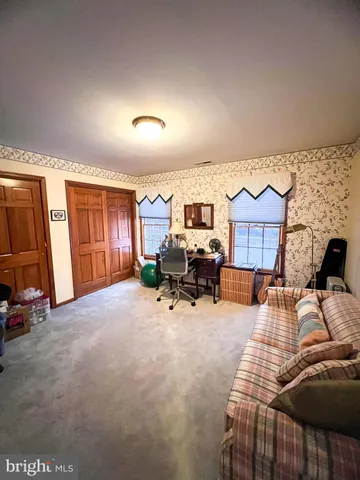 a view of a livingroom with furniture and tv