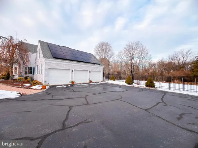 a view of a street with a house