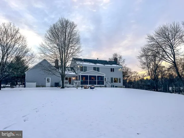 a wooden bench sitting in front of a building