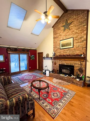a bedroom with furniture and a fireplace
