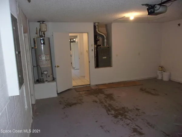 a white toilet sitting next to a bath tub