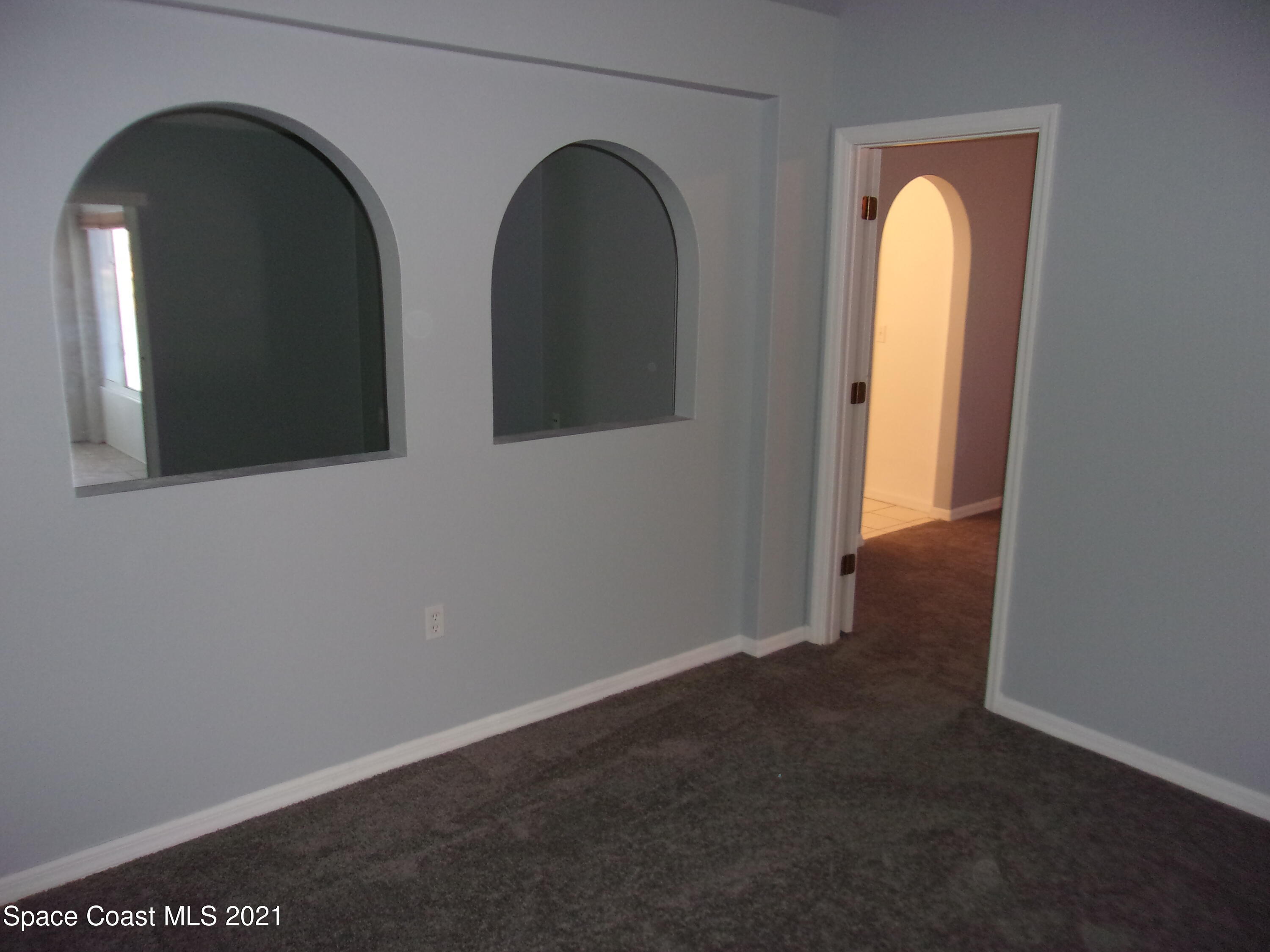 3908 Upmann Drive Rockledge, FL 32955 - Photo 27 of 35 a view of a livingroom with a large window