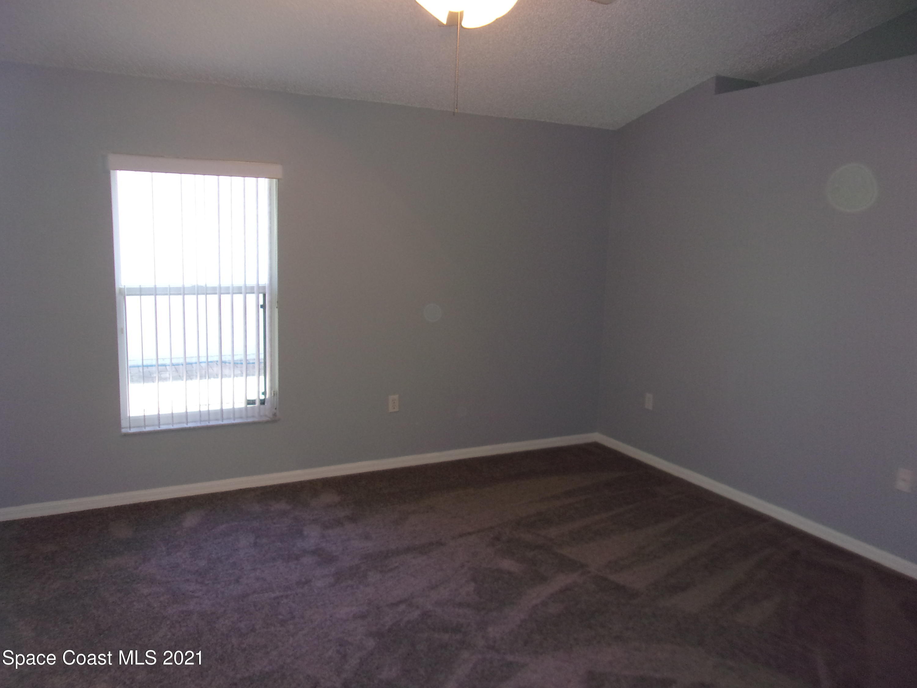3908 Upmann Drive Rockledge, FL 32955 - Photo 28 of 35 an empty room with a window
