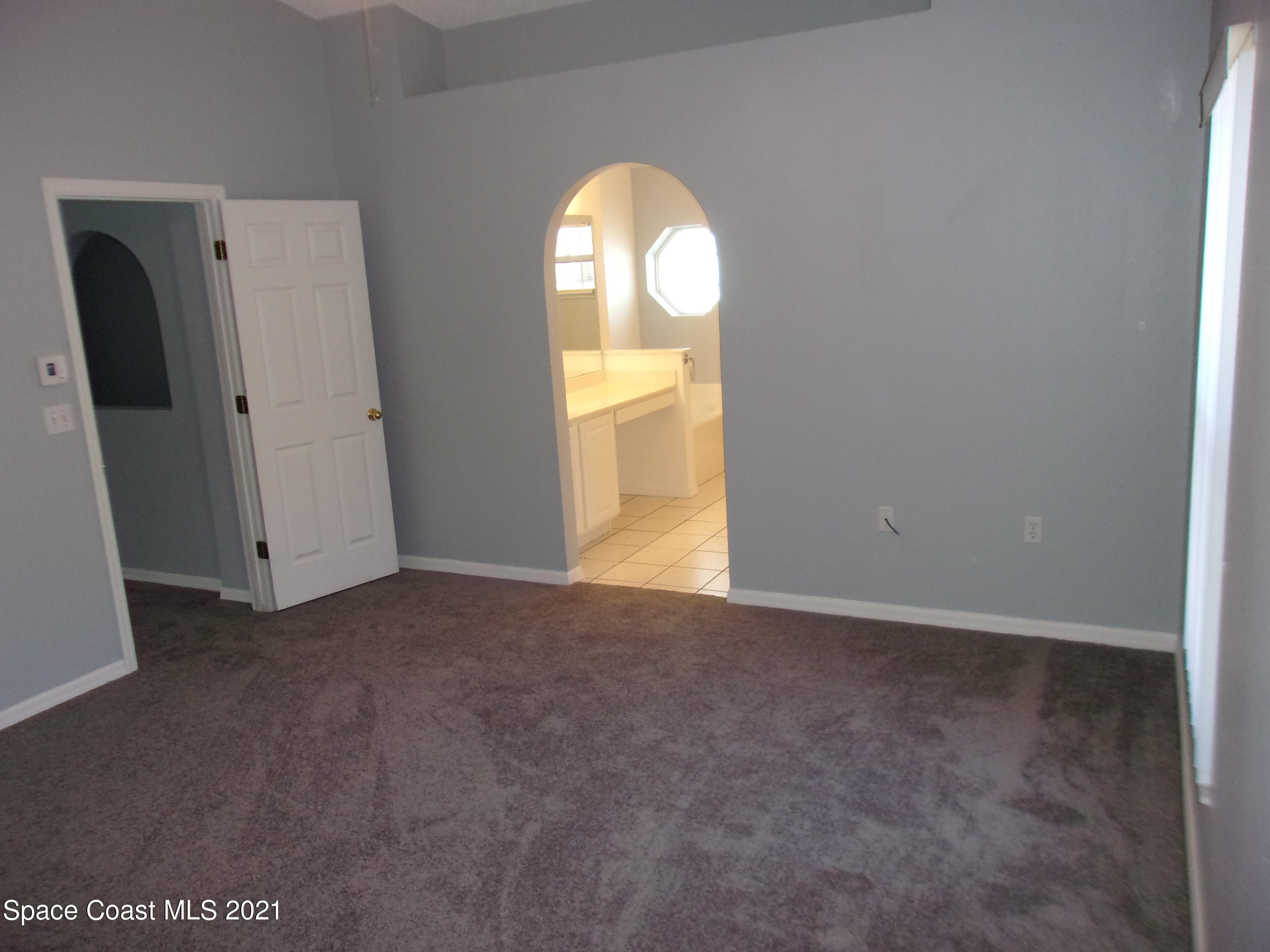 3908 Upmann Drive Rockledge, FL 32955 - Photo 30 of 35 an empty room with a window