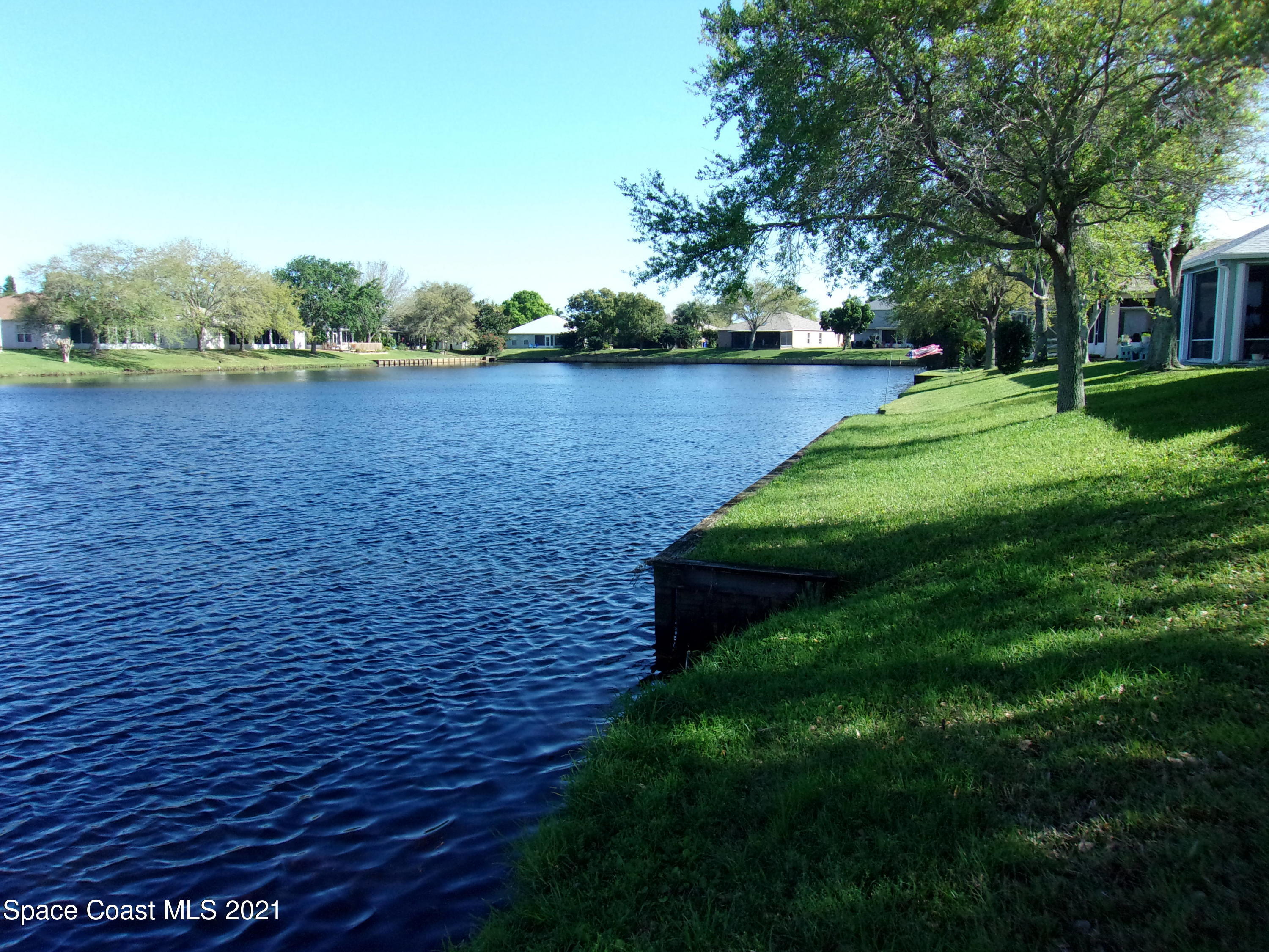 3908 Upmann Drive Rockledge, FL 32955 - Photo 4 of 35 a view of a lake with a yard
