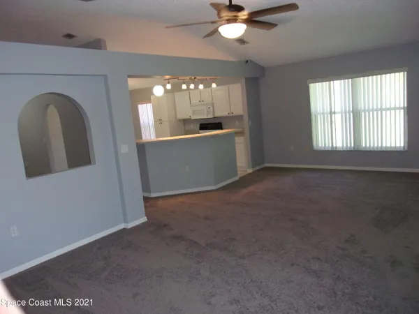 an empty room that has a window