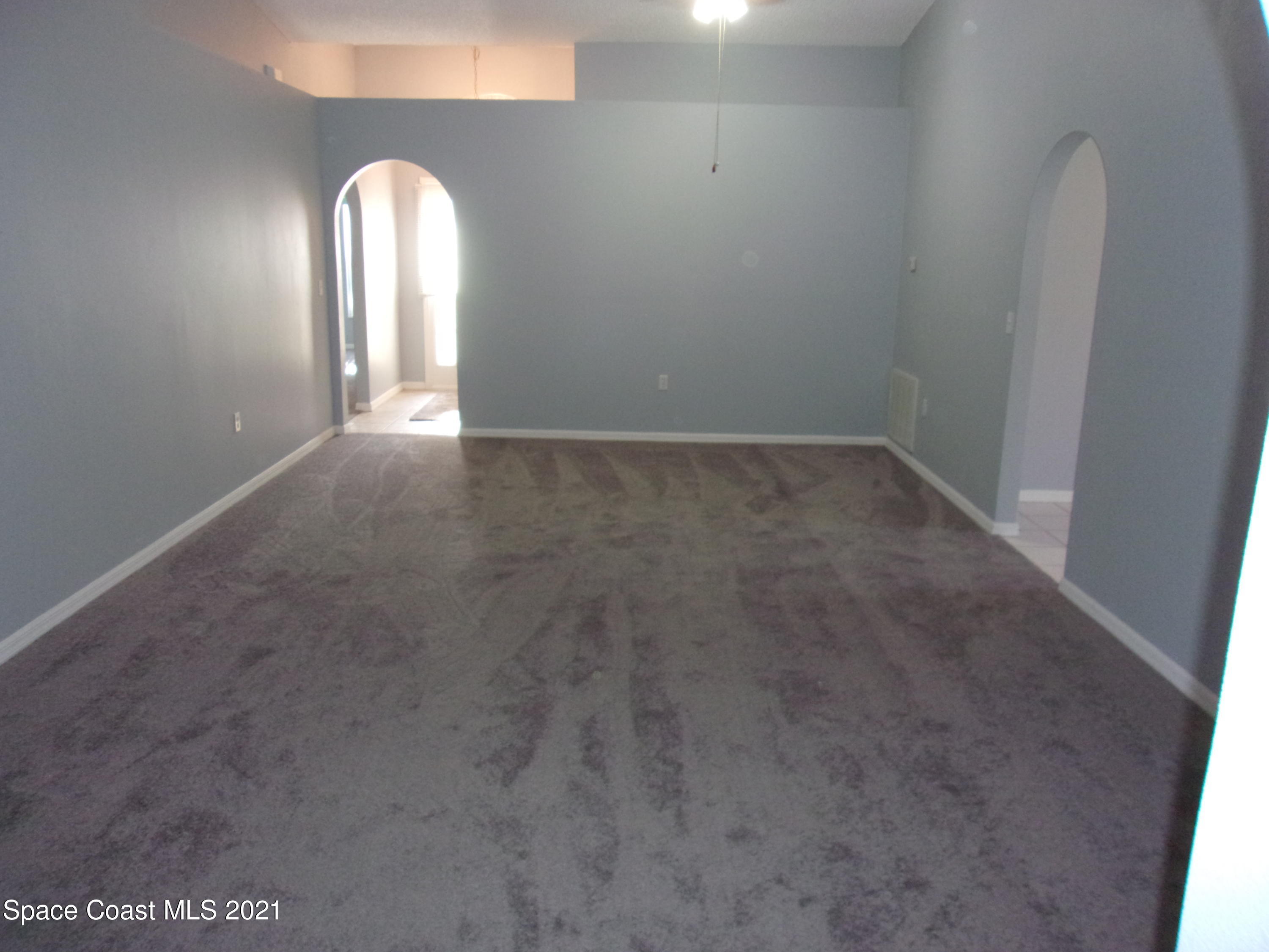 3908 Upmann Drive Rockledge, FL 32955 - Photo 7 of 35 an empty room that has a window
