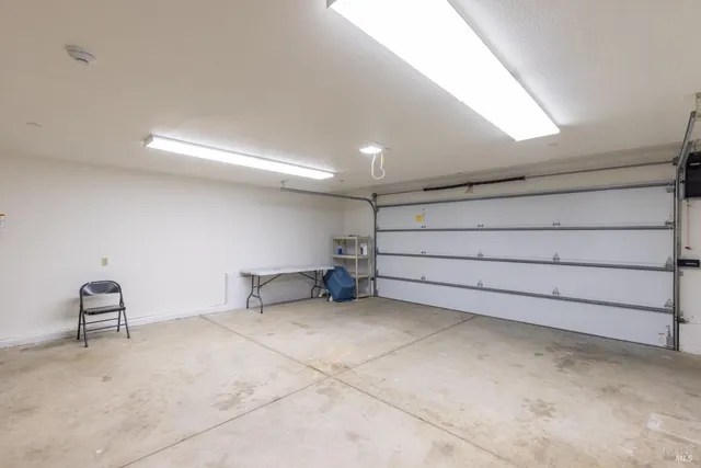 a view of room with garage and furniture