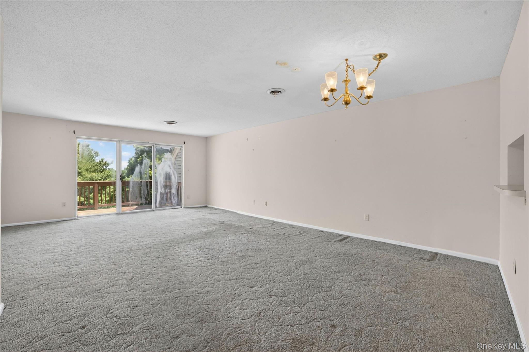 116 Fields Lane Peekskill, NY 10566 - Photo 9 of 40 a view of an empty room with a window