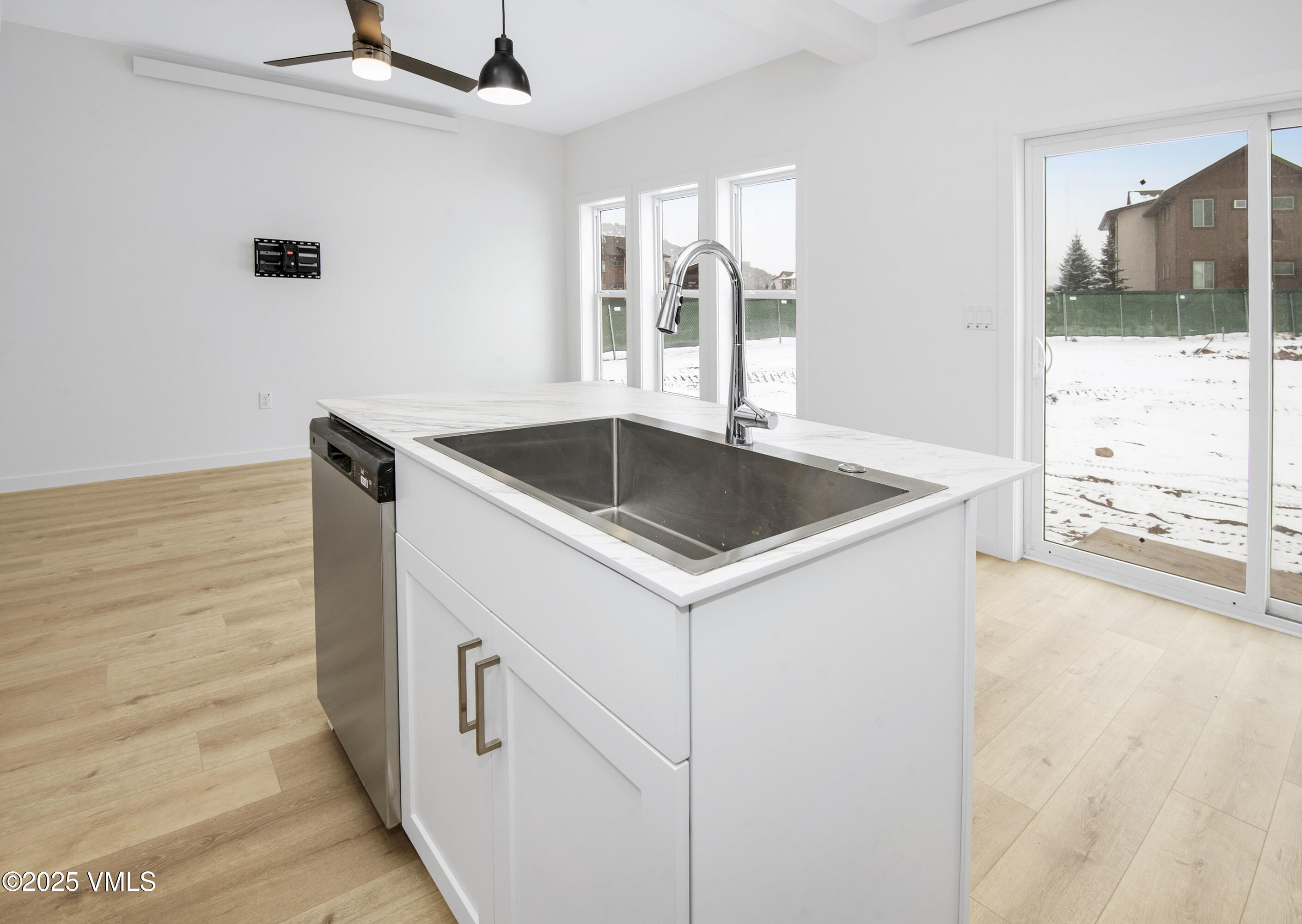 60 Comanche Way Gypsum, CO 81637 - Photo 4 of 46 a kitchen with a sink and a refrigerator