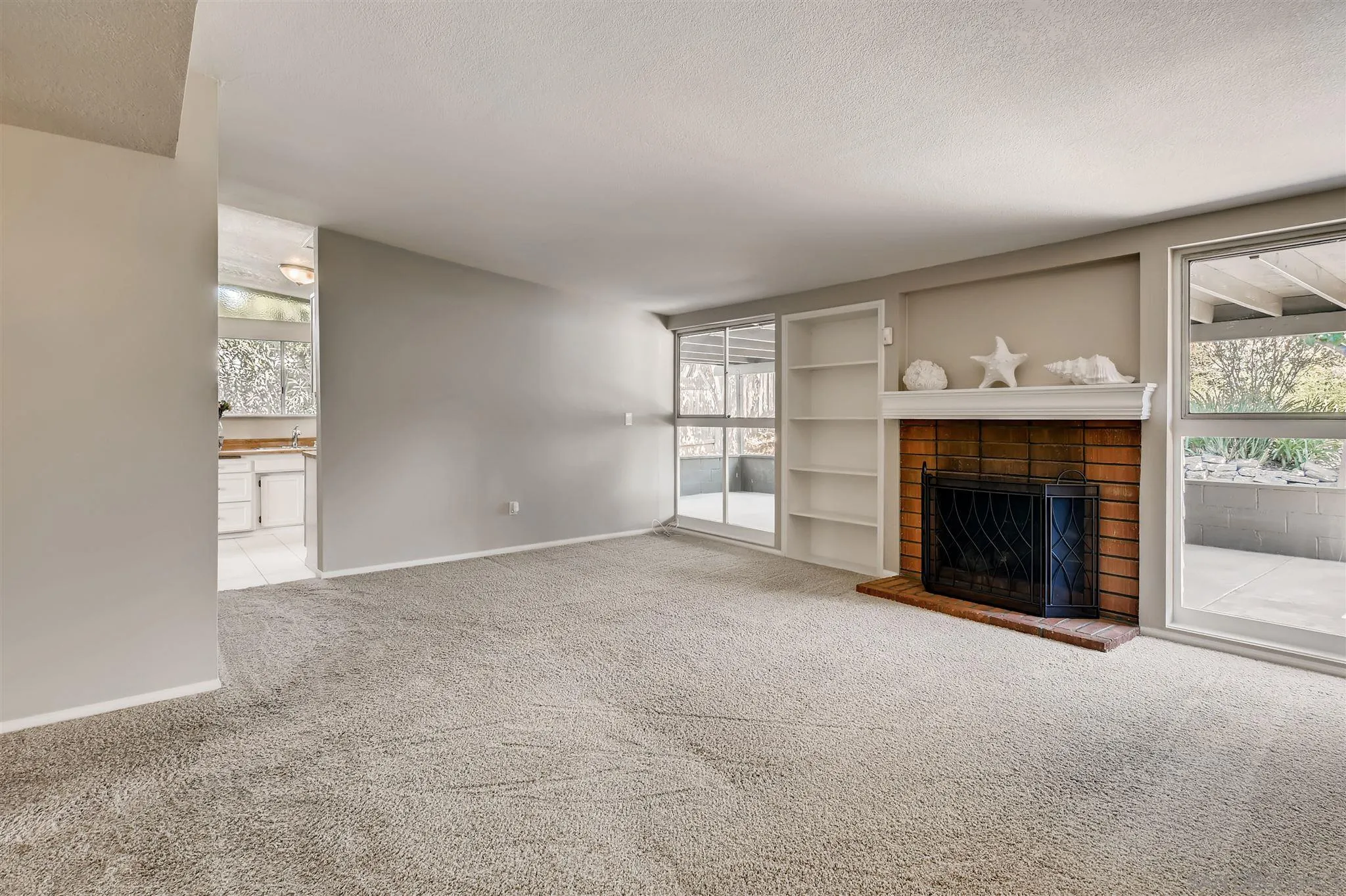 13815 Frame Road Poway, CA 92064 - Photo 3 of 12 an empty room with windows and fireplace