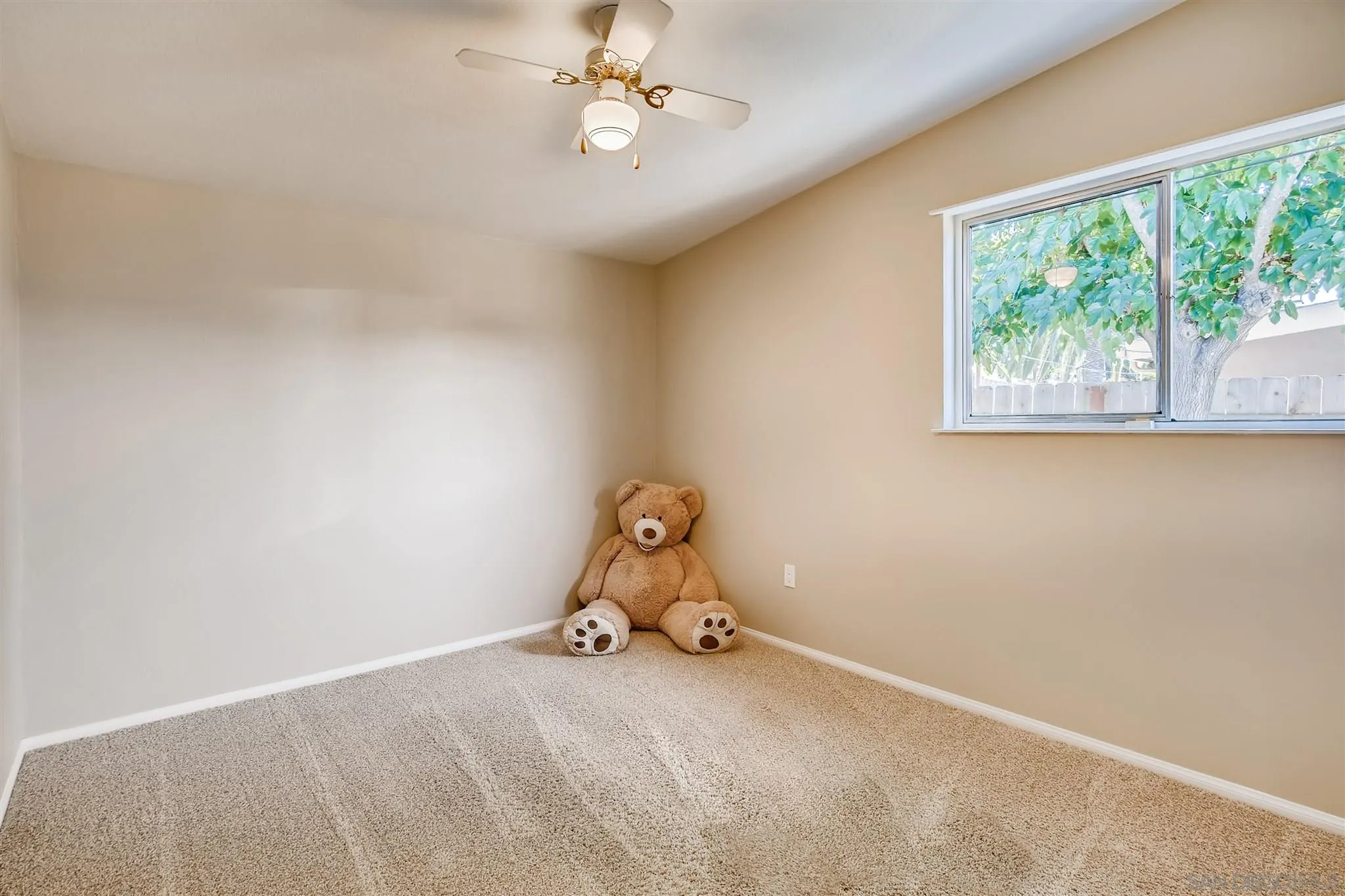 13815 Frame Road Poway, CA 92064 - Photo 10 of 12 a room with a window and ceiling fan