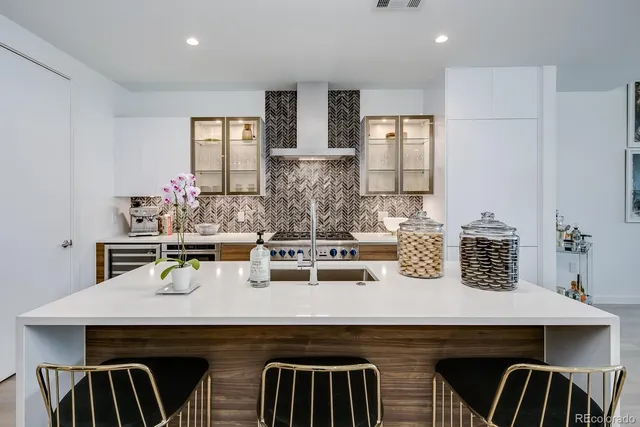 a kitchen with a sink a cabinets and counter space