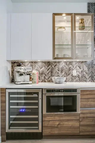 a view of wooden cabinets and a stove top oven