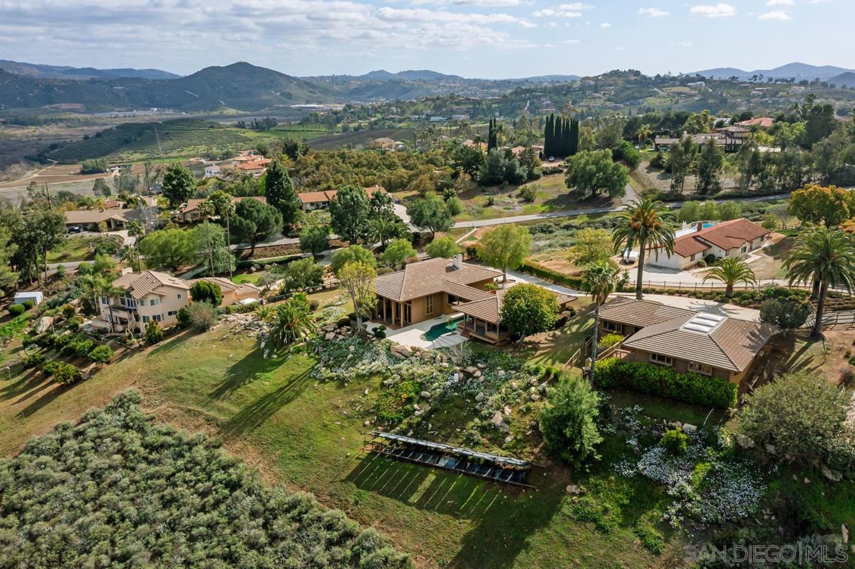 an aerial view of residential house with outdoor space and river