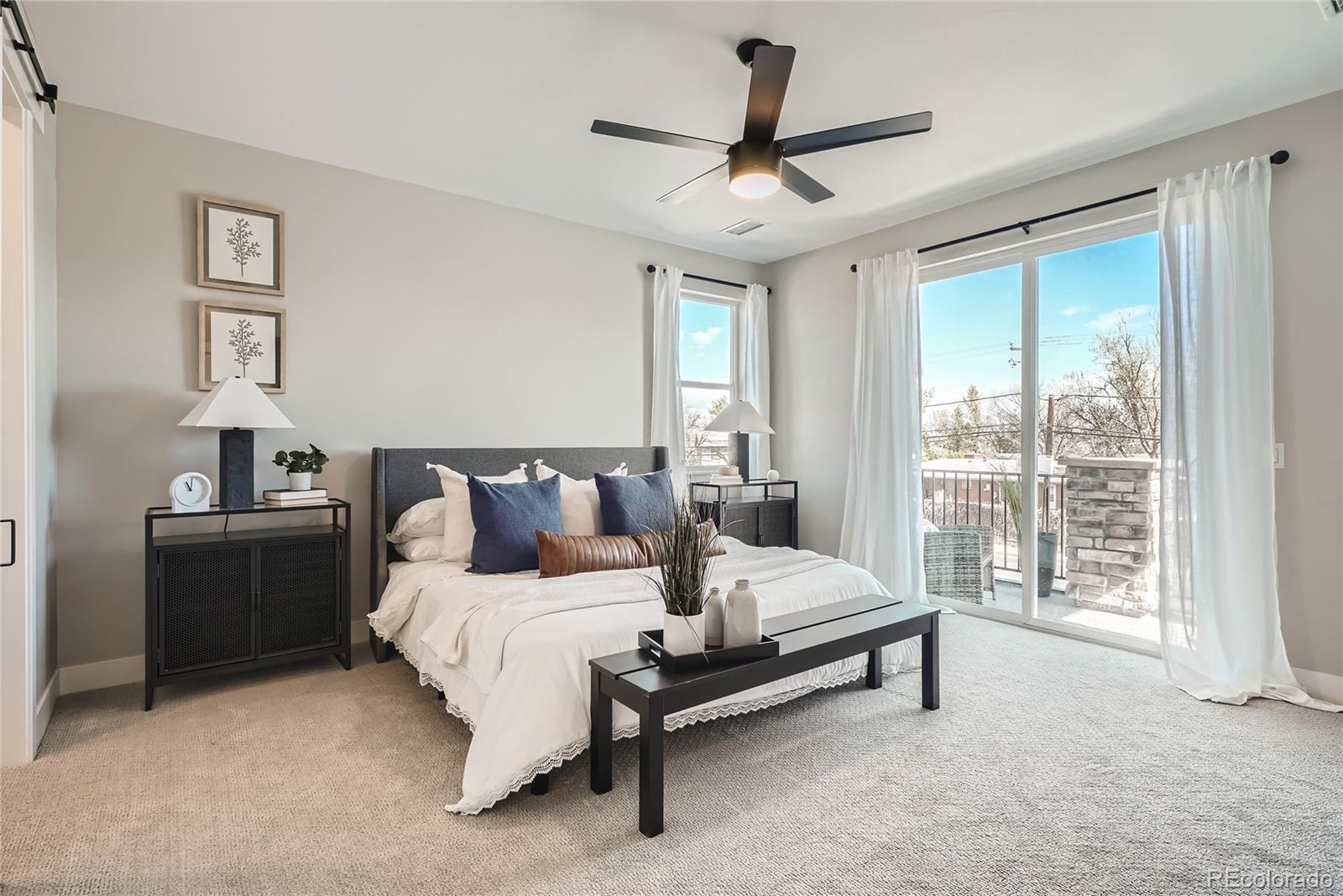 308 East Orchard Road Centennial, CO 80121 - Photo 13 of 26 a bed room with a bed and a lamp