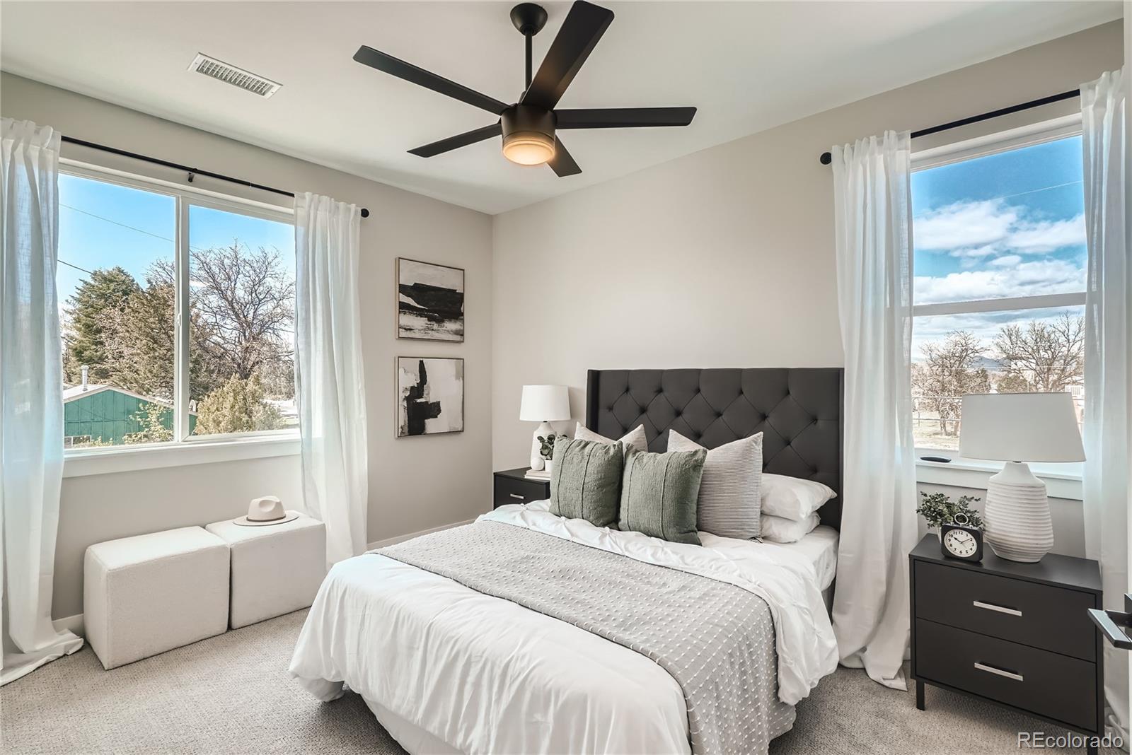 308 East Orchard Road Centennial, CO 80121 - Photo 17 of 26 a bedroom with a bed and a large window