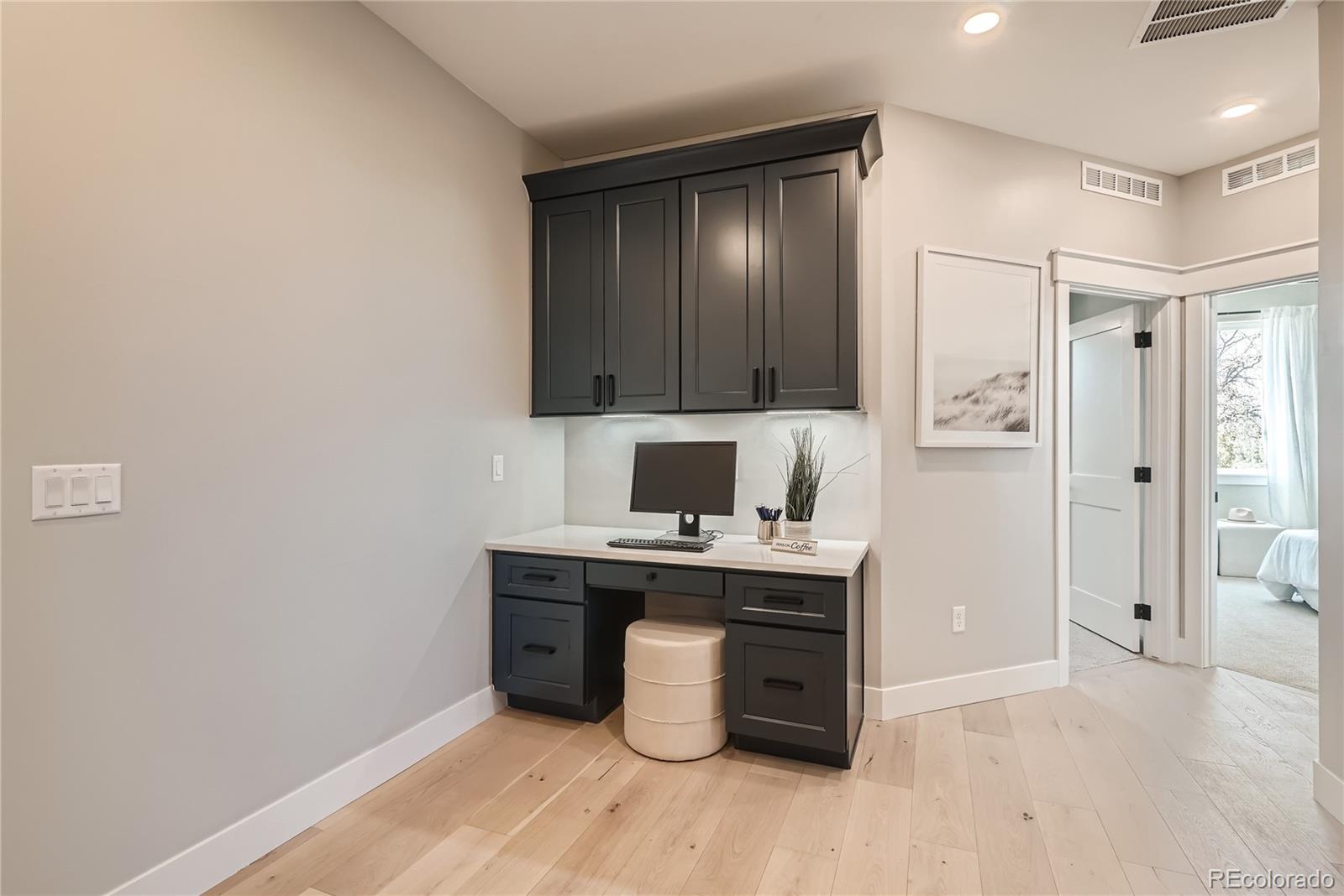 308 East Orchard Road Centennial, CO 80121 - Photo 19 of 26 a view of kitchen with stainless steel appliances cabinets and wooden floor