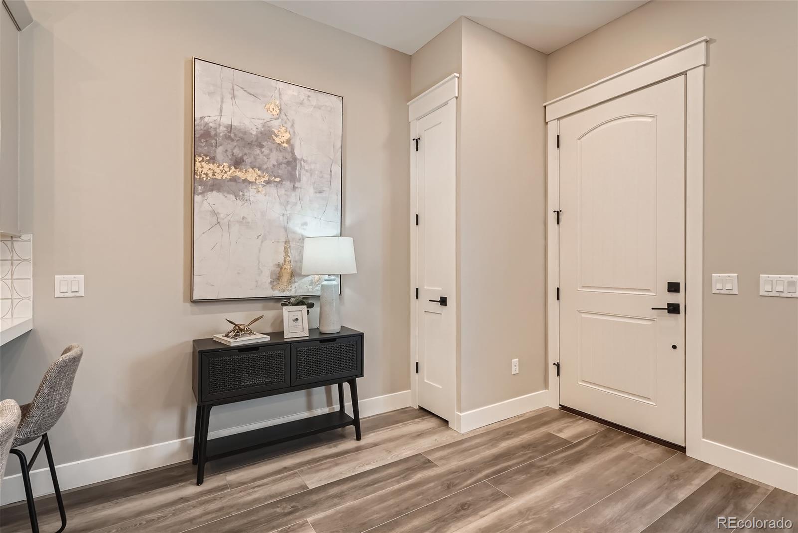 308 East Orchard Road Centennial, CO 80121 - Photo 2 of 26 a view of a room with wooden floor and windows