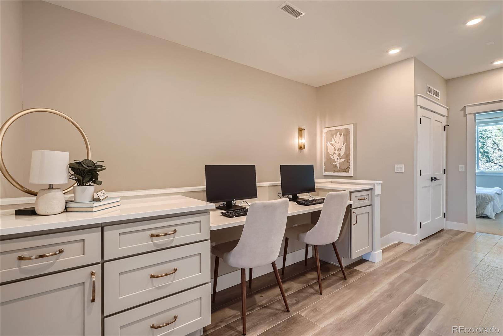 308 East Orchard Road Centennial, CO 80121 - Photo 24 of 26 a workspace with a table chair and a living room