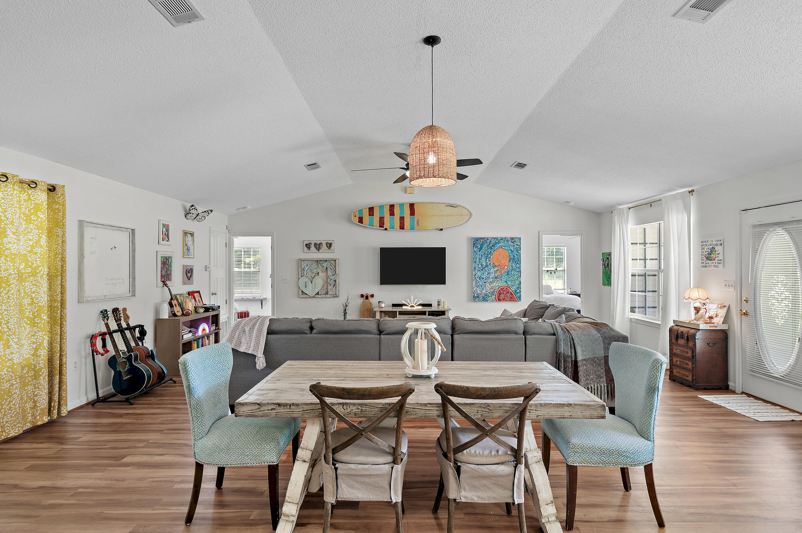 675 Spring Hill Road DeFuniak Springs, FL 32433 - Photo 6 of 46 a view of a dining room with furniture wooden floor and chandelier