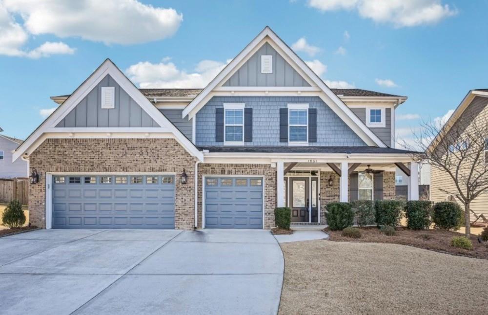 1851 Primrose Park Road Sugar Hill, GA 30518 - Photo 1 of 1 a front view of a house with a yard
