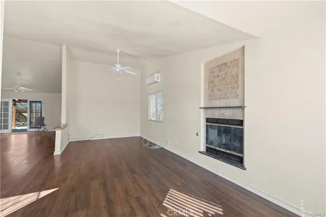 a view of livingroom with hardwood floor and hallway