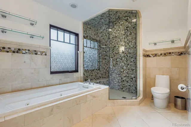 a bathroom with a bathtub and shower