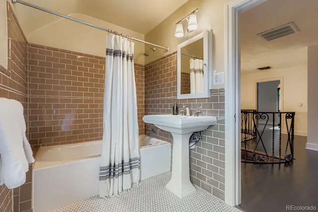 a bathroom with a sink and a bathtub