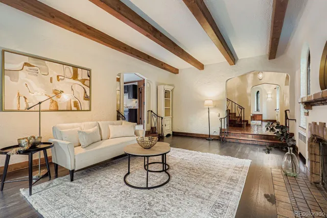 a living room with furniture and a rug