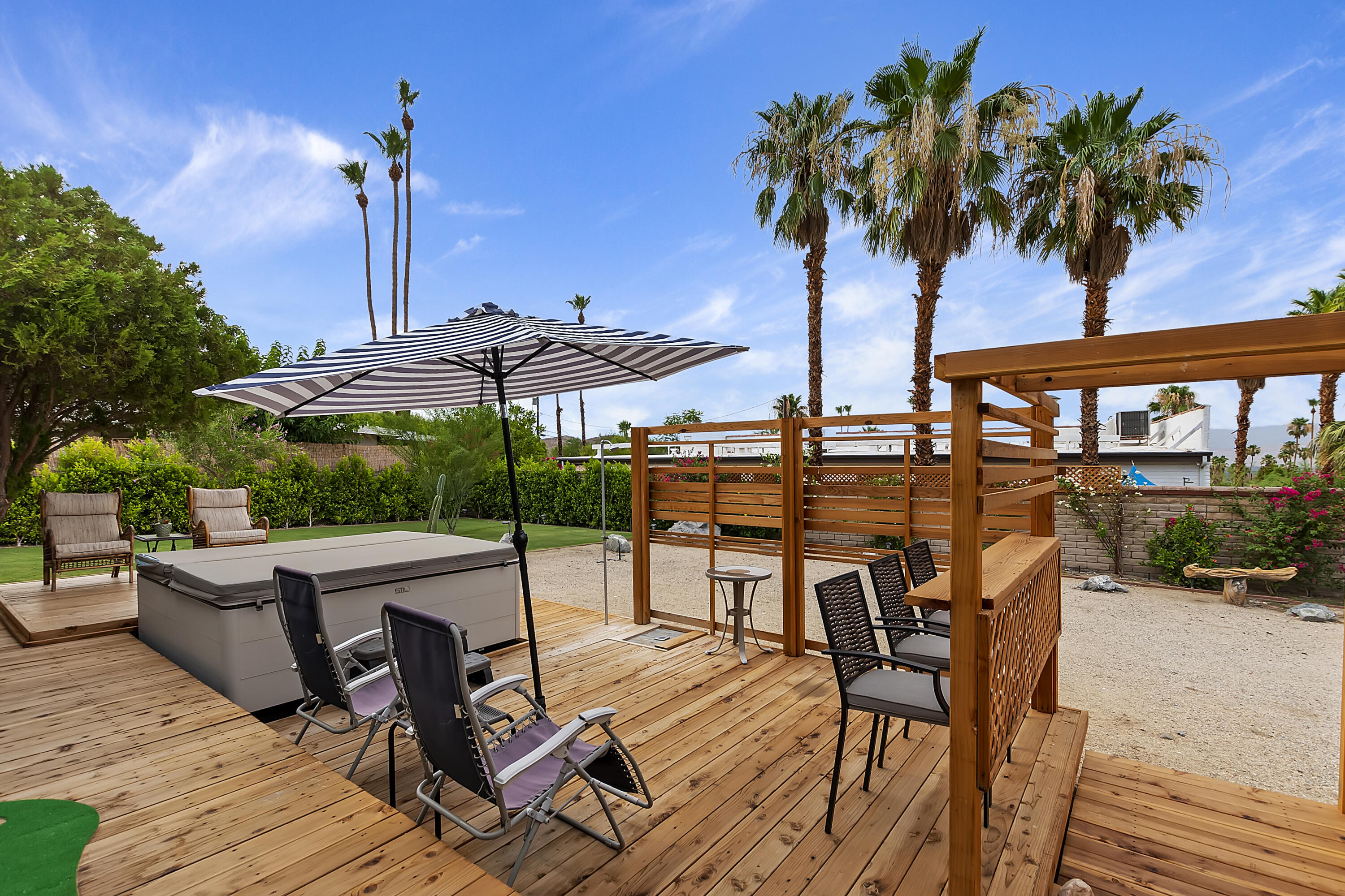 38957 Miller Lane Cathedral City, CA 92234 - Photo 1 of 34 a view of a backyard with sitting area and furniture