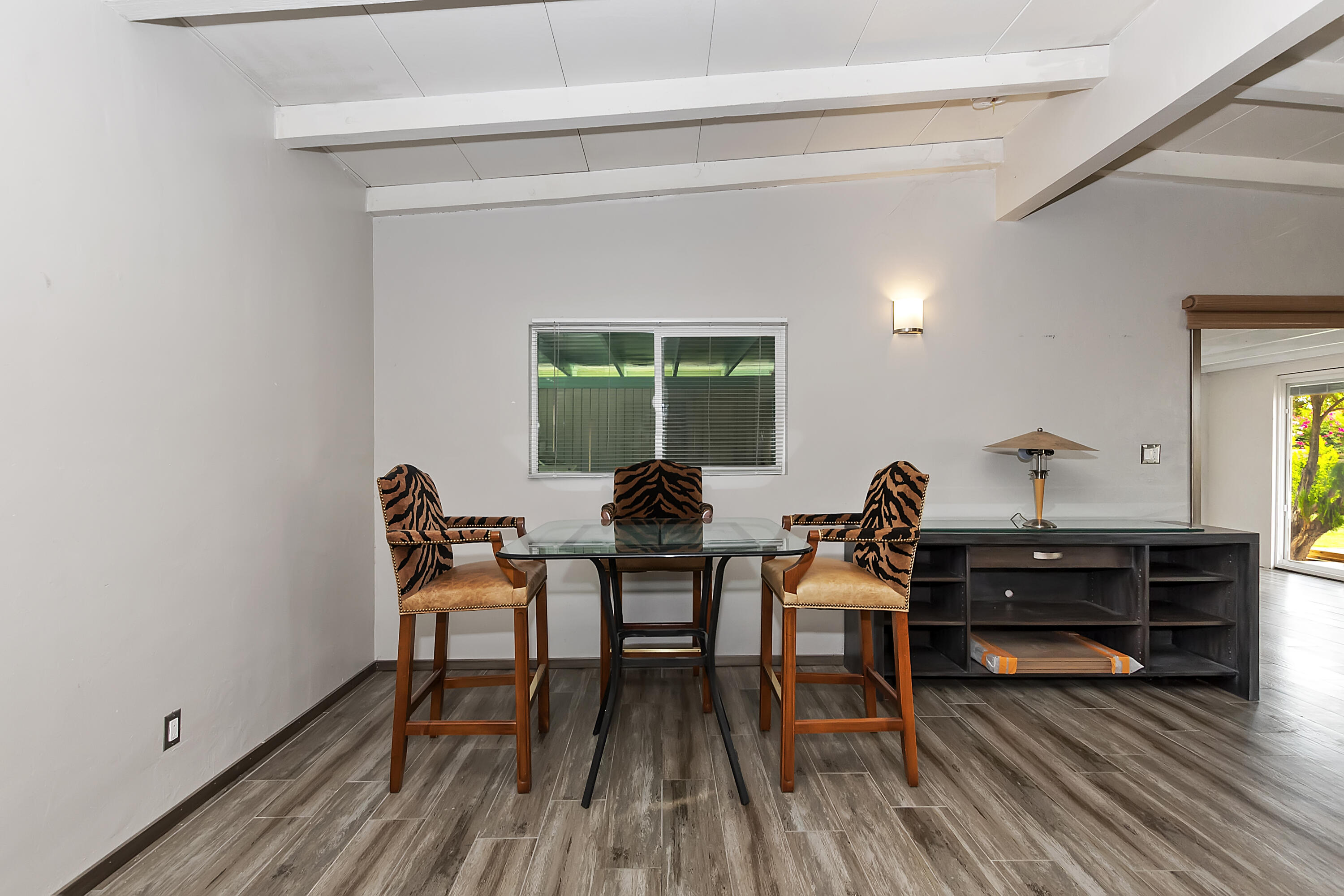 38957 Miller Lane Cathedral City, CA 92234 - Photo 11 of 34 a dining room with furniture and wooden floor