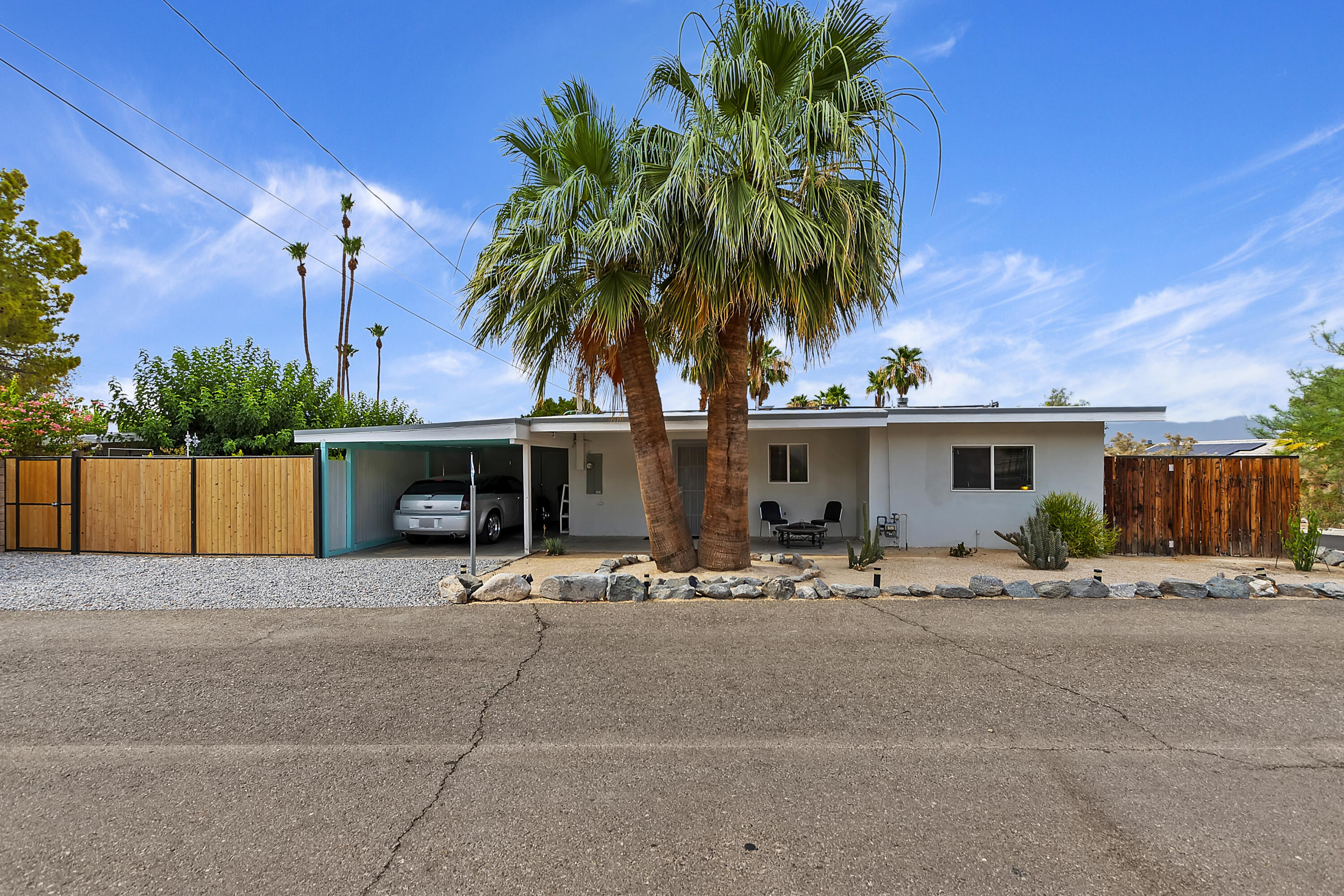 38957 Miller Lane Cathedral City, CA 92234 - Photo 2 of 34 a group of palm trees in front of house
