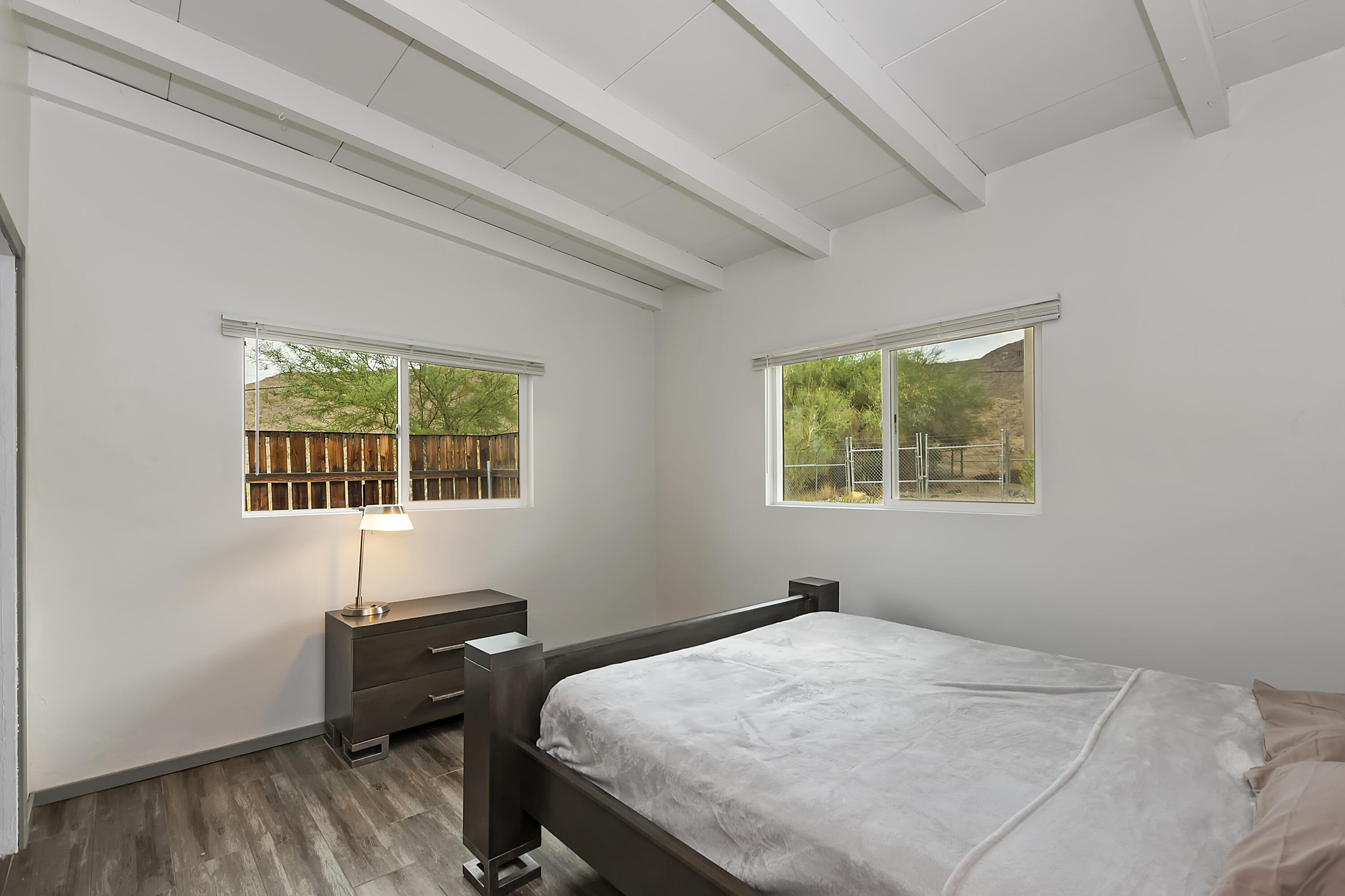 38957 Miller Lane Cathedral City, CA 92234 - Photo 23 of 34 a bedroom with a bed and a window
