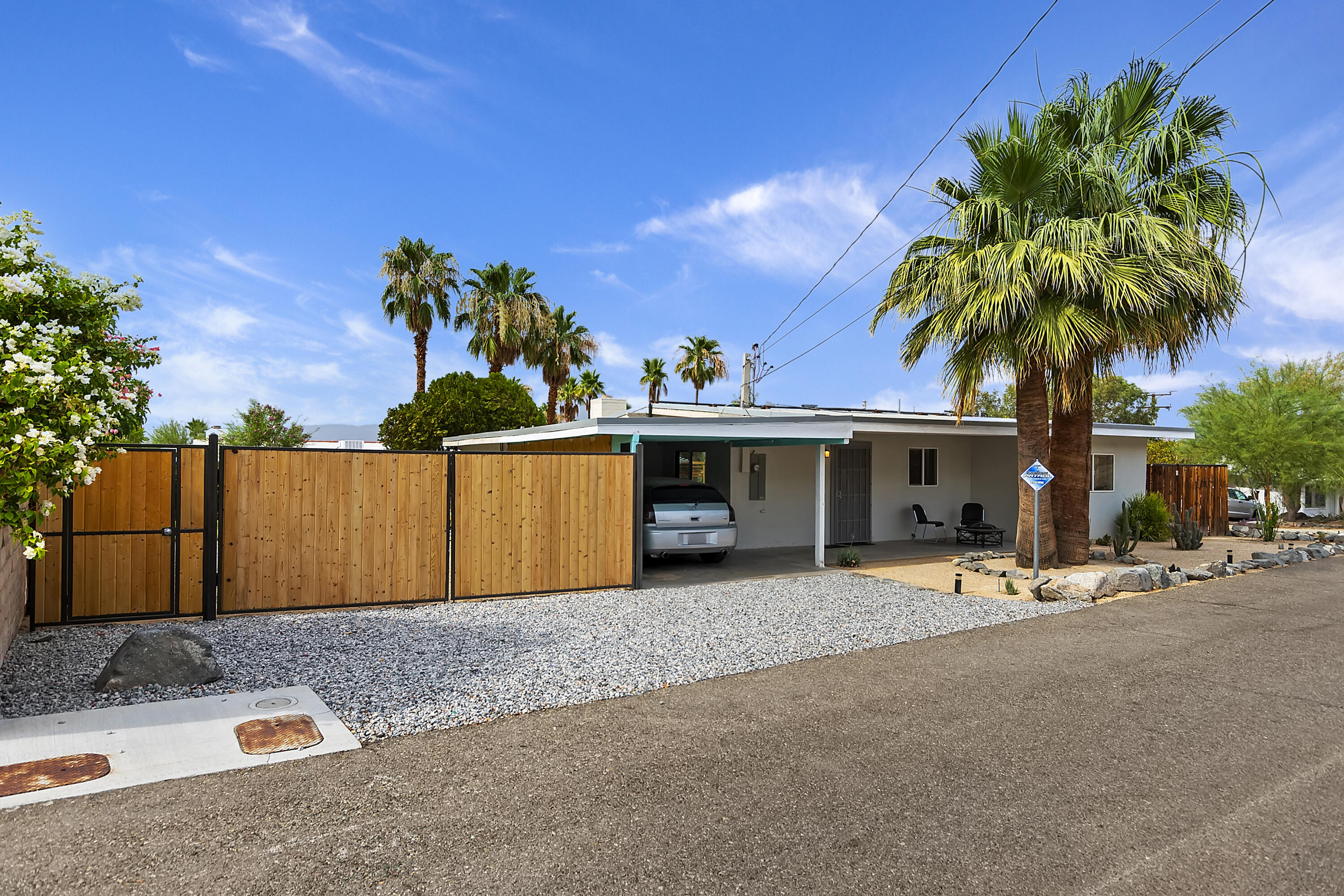 38957 Miller Lane Cathedral City, CA 92234 - Photo 3 of 34 a view of a backyard with a garden