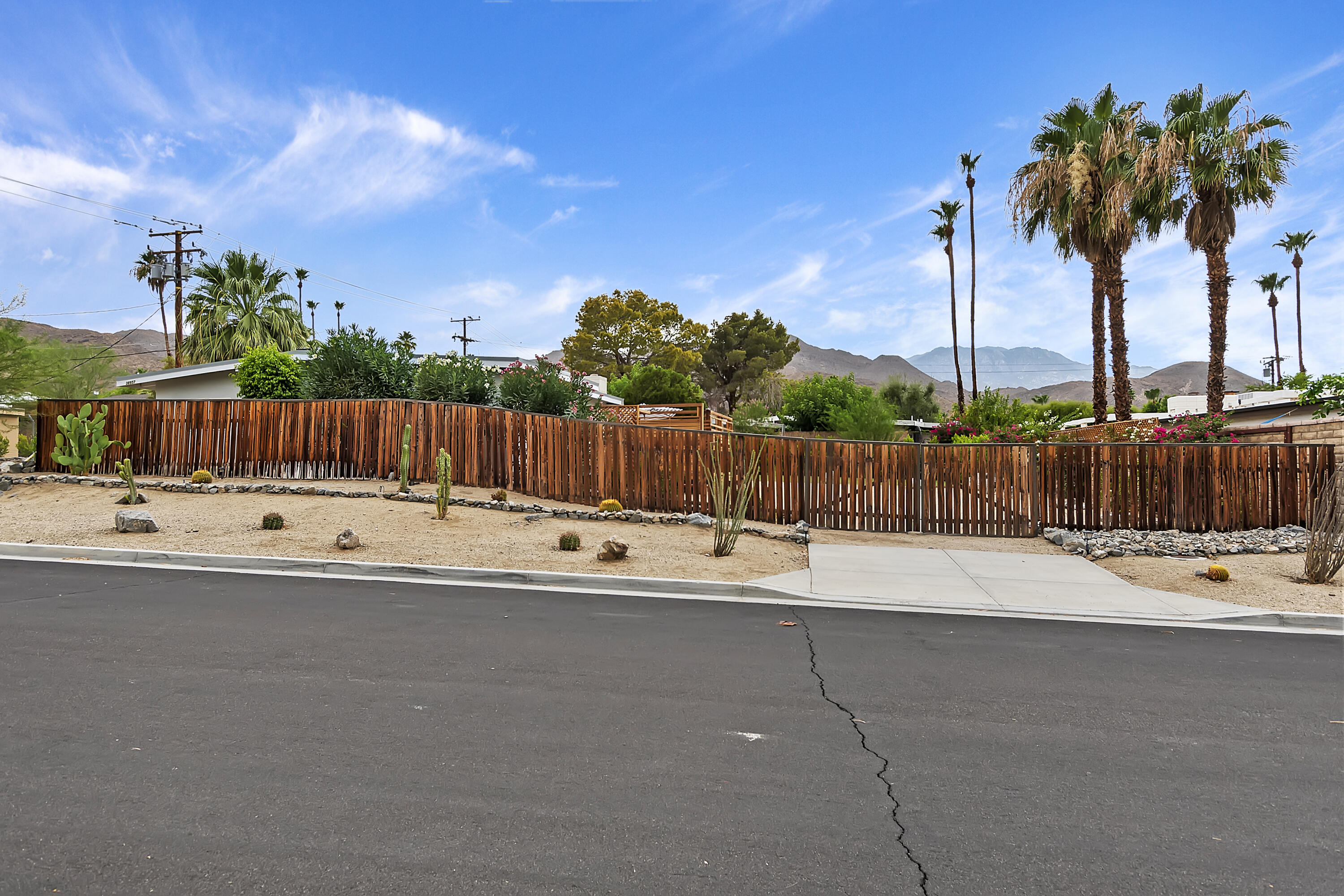 38957 Miller Lane Cathedral City, CA 92234 - Photo 34 of 34 a view of swimming pool with a yard and palm trees