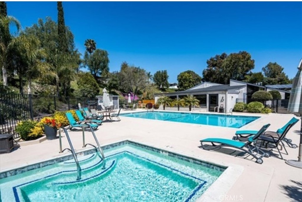 31130 South General Kearny Road, Unit 145 Temecula, CA 92591 - Photo 26 of 27 a swimming pool with outdoor seating and yard