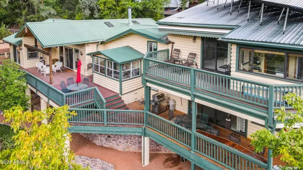 an aerial view of a house with yard and outdoor seating